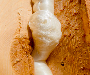 upclose photo of air sealing insulation in home's wall.