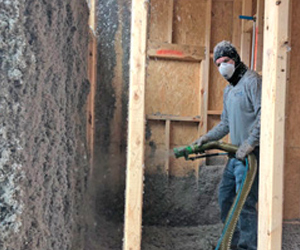 Cellulose installer insulating Tennessee home.